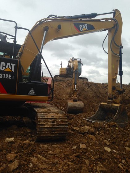 Two CAT diggers working on a site