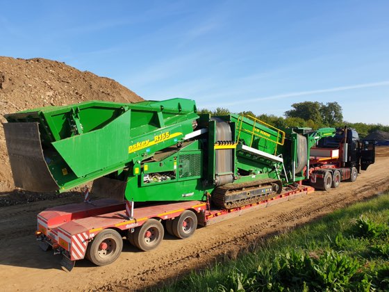 Green crusher on a low-loader ready for delivery
